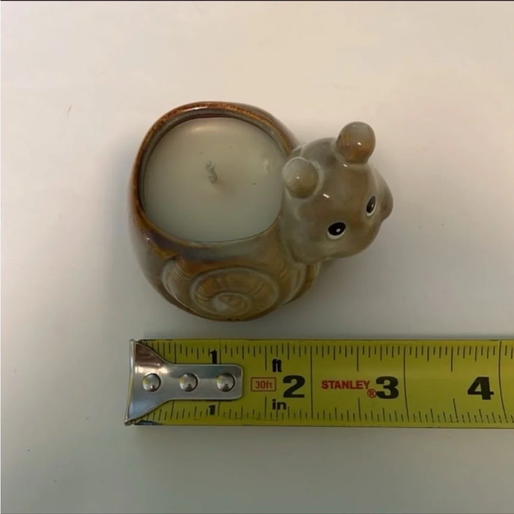 Vintage cottagecore ceramic smiling snail candle